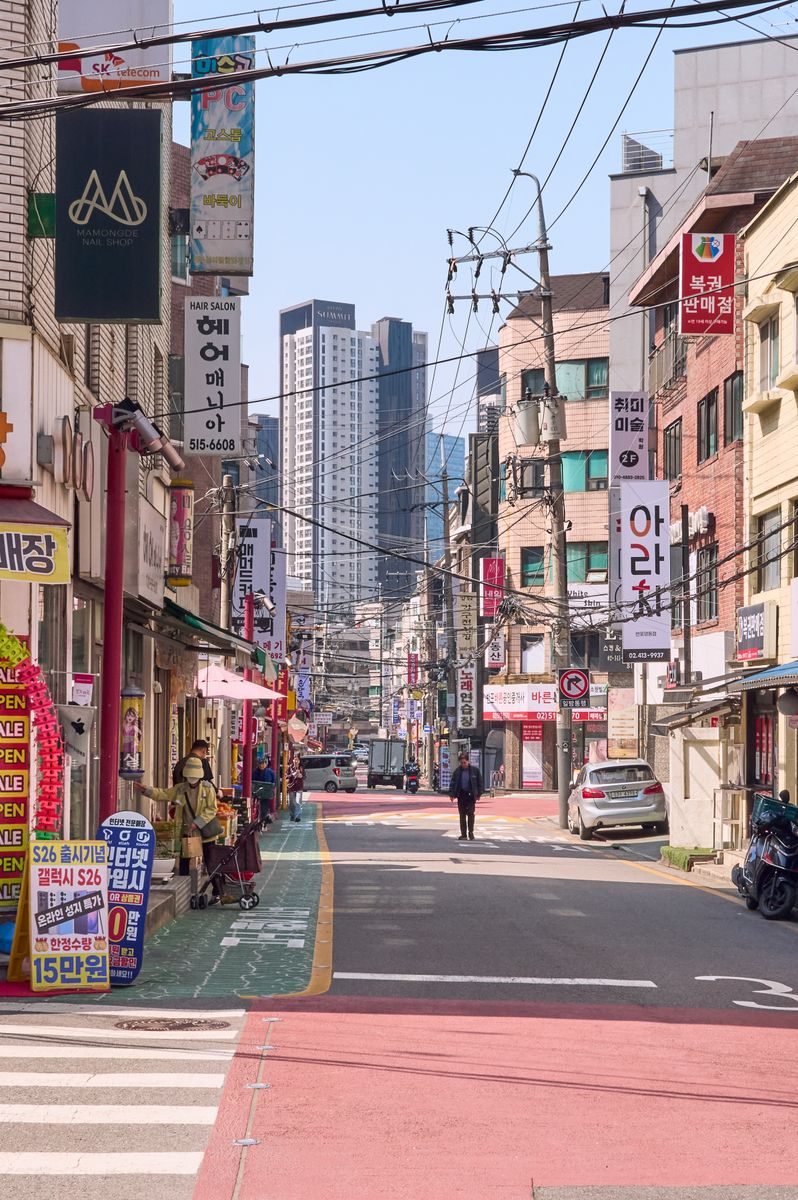 Colorful street view with urban buildings in South Korea's lively cityscape.