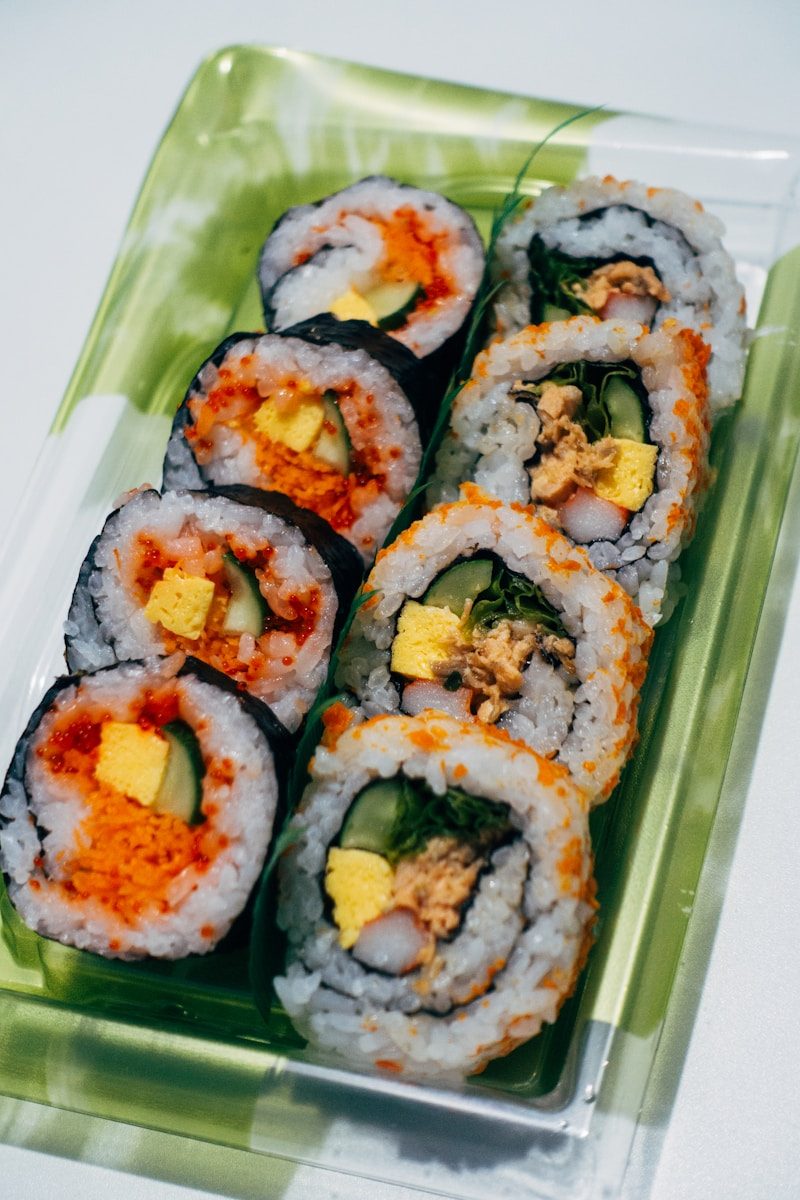 Sliced kimbap rolls filled with vegetables and egg on a plate