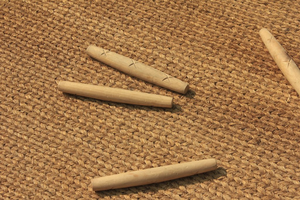 Traditionally, rice straw was spread on the floor where Yut sticks were thrown.