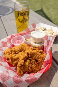 Fried chicken and a glass of beer on a table
