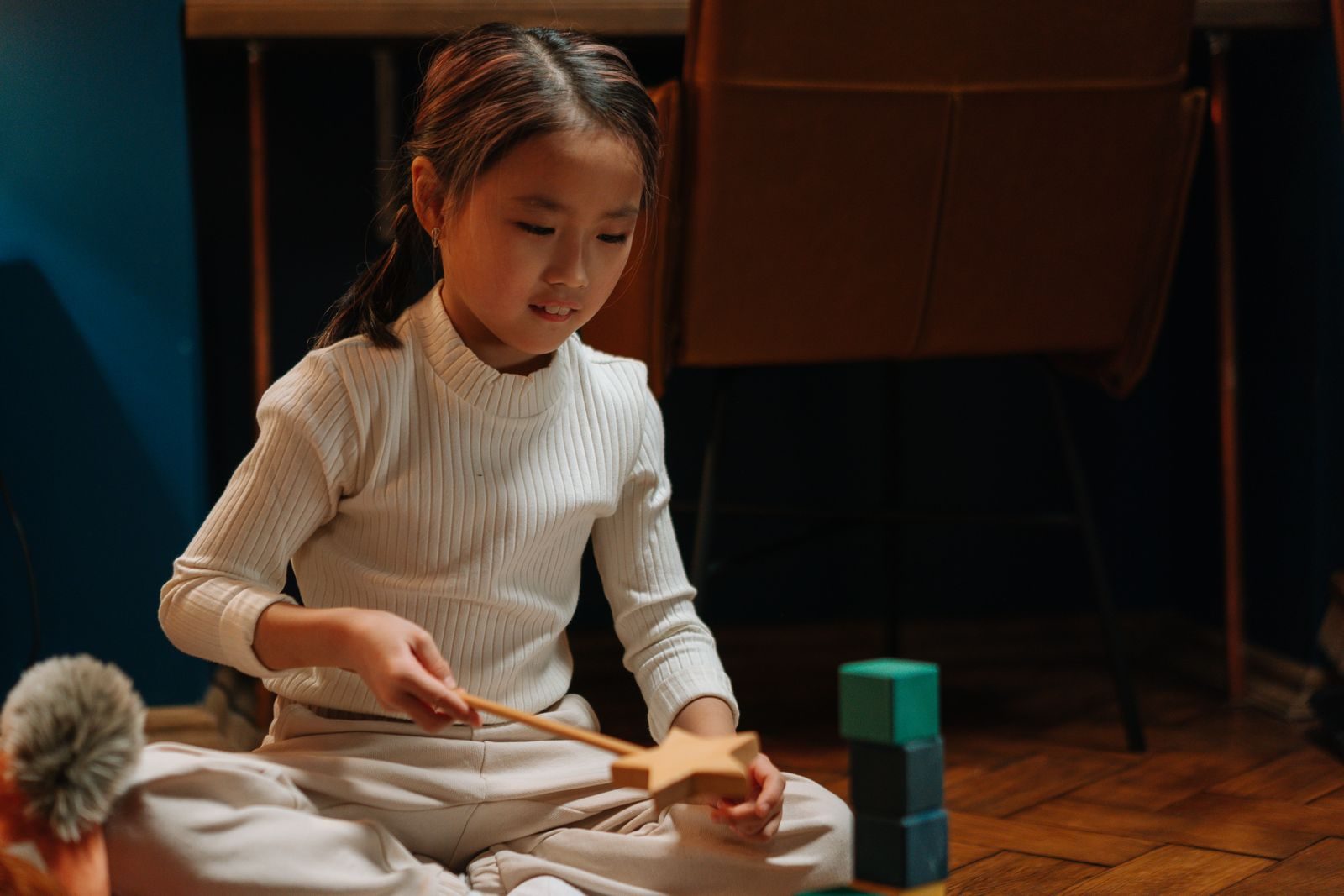 Traditional wooden toys and game pieces on a wooden surface