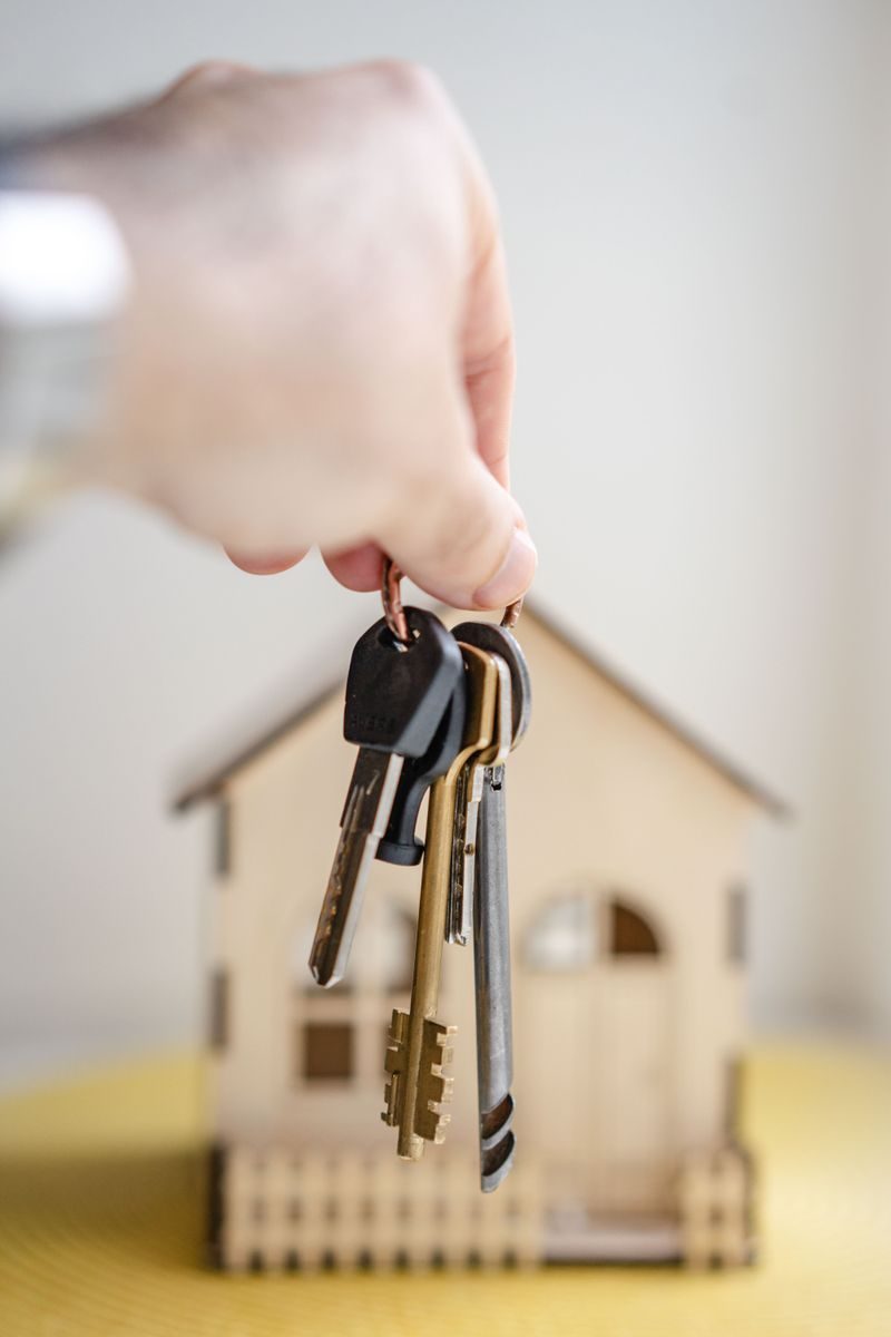 The landlord gives the house keys to the tenant under the lease agreement.