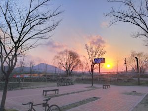 A small exercise area is visible at the entrance of the ecological park.