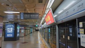 An Incheon Subway Line 1 train stopped at a platform with screen doors open