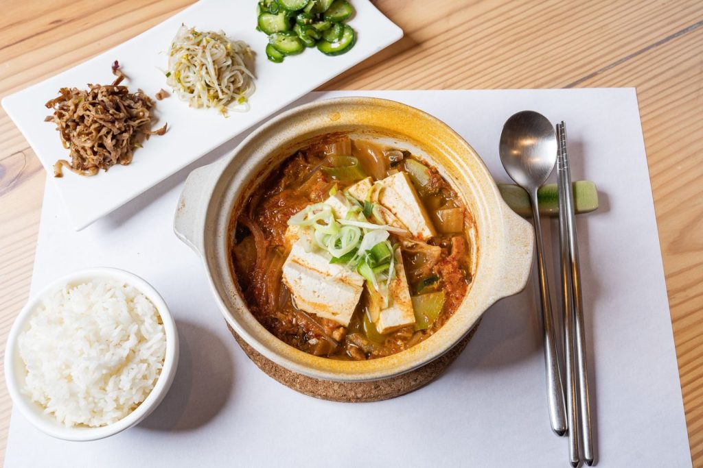 A simple Korean home meal with rice, stew and side dishes