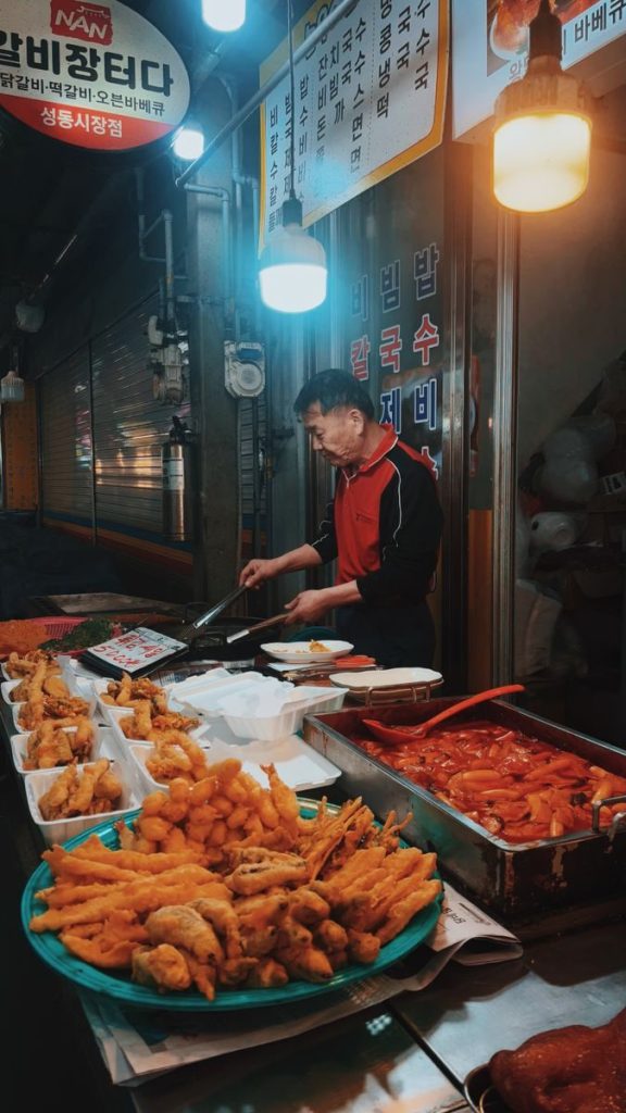 A small Korean snack shop counter with prepared food