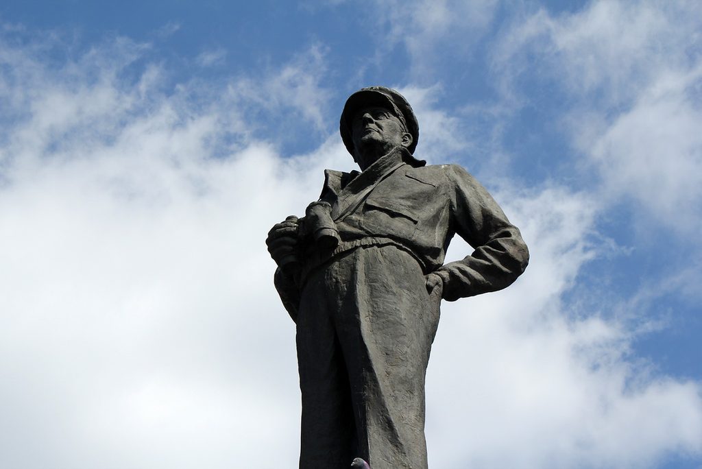 MacArthur statue on its pedestal surrounded by bare winter trees
